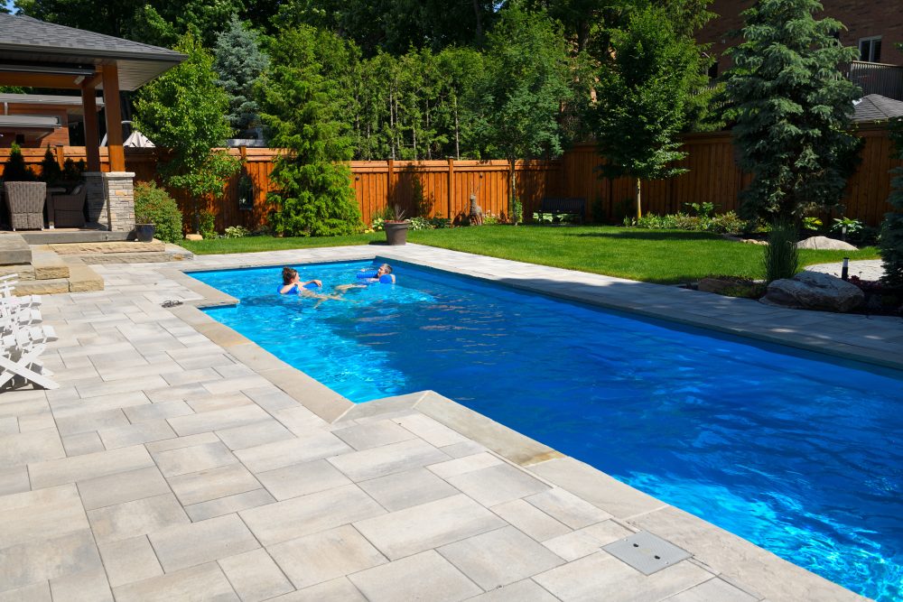 Dive Into Perfection: The Essential Role of Lawn Leveling in Pool Installation